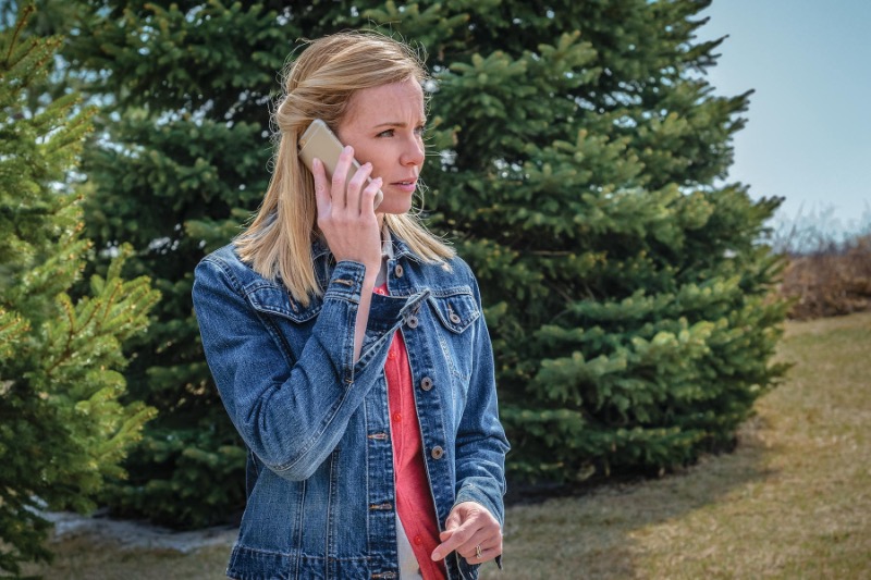 Woman making a concerned phone call